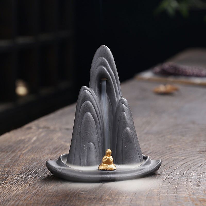 Serene Mountain Backflow Incense Burner with Golden Meditating Figure for Spiritual Cleansing and Zen Decor