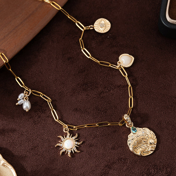 Celestial Charm Necklace: Radiant Sun and Moon Pendant with Pearl Accents